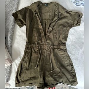 Olive-colored short sleeve and shorts jumpsuit